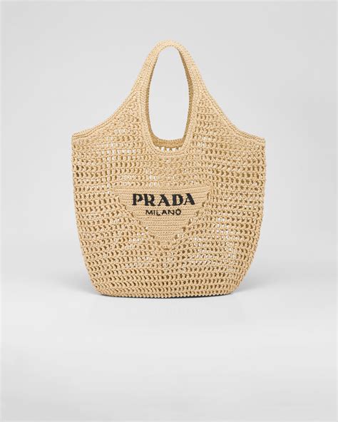 prada raffia beach tote.